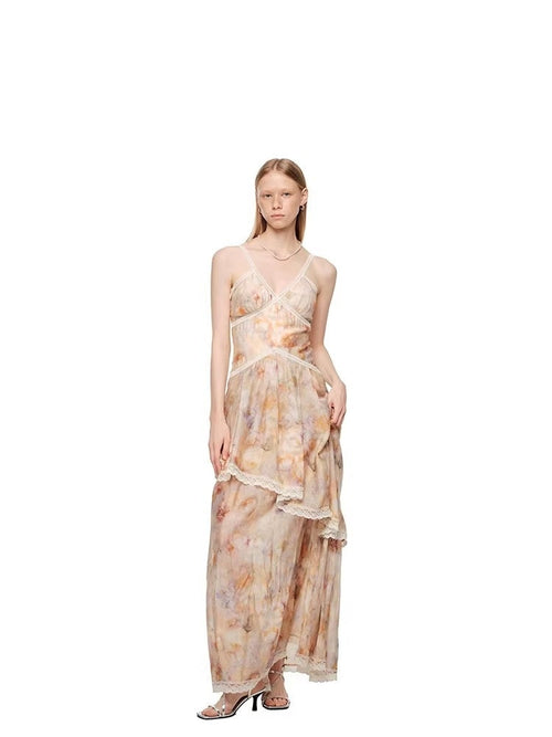 A stylish, waist-cinched strapless dress featuring lace panels and an oil painting print